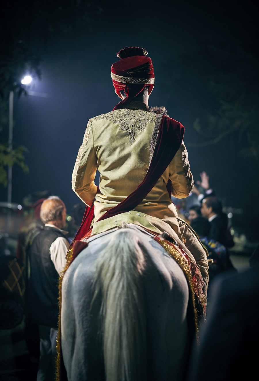 Groom riding a decorated horse during a night baarat procession