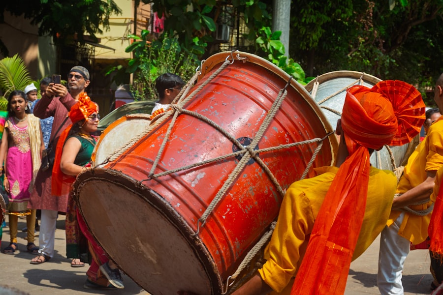 Close-up of a dhol drum being played in a street procession
