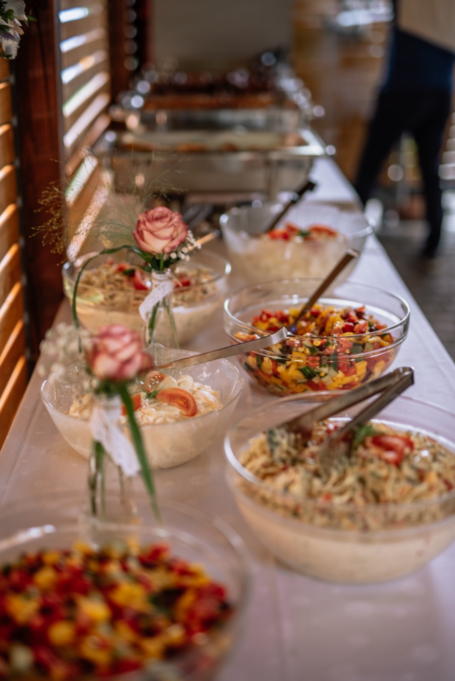 Wedding dessert table with tiered cake in a garden