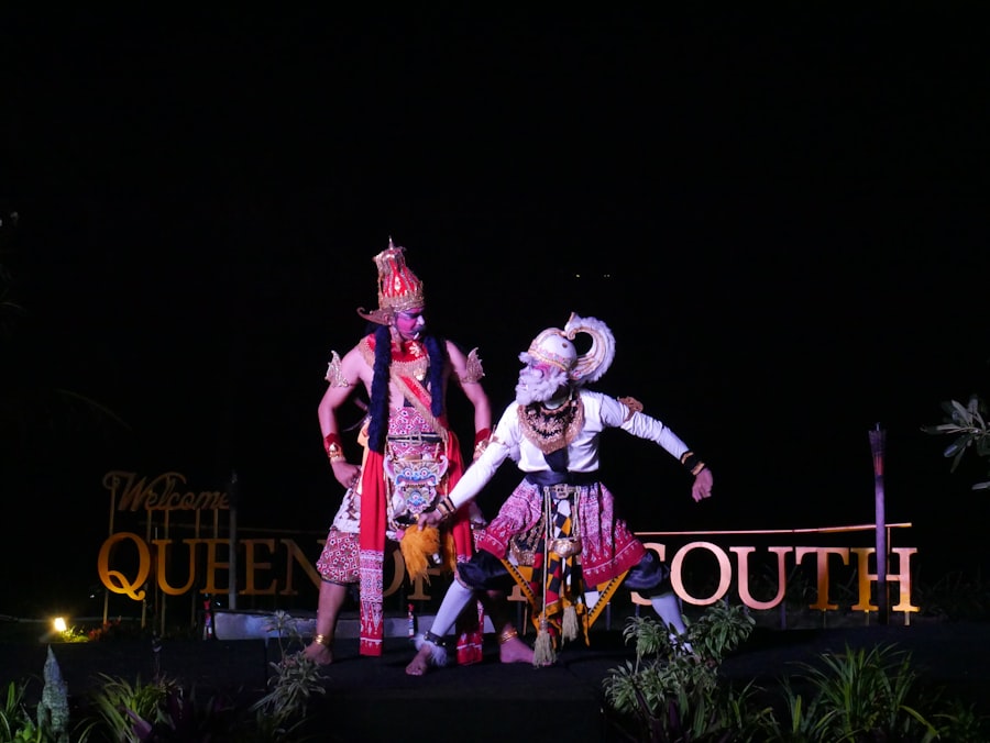 Two dancers performing a traditional duet at night