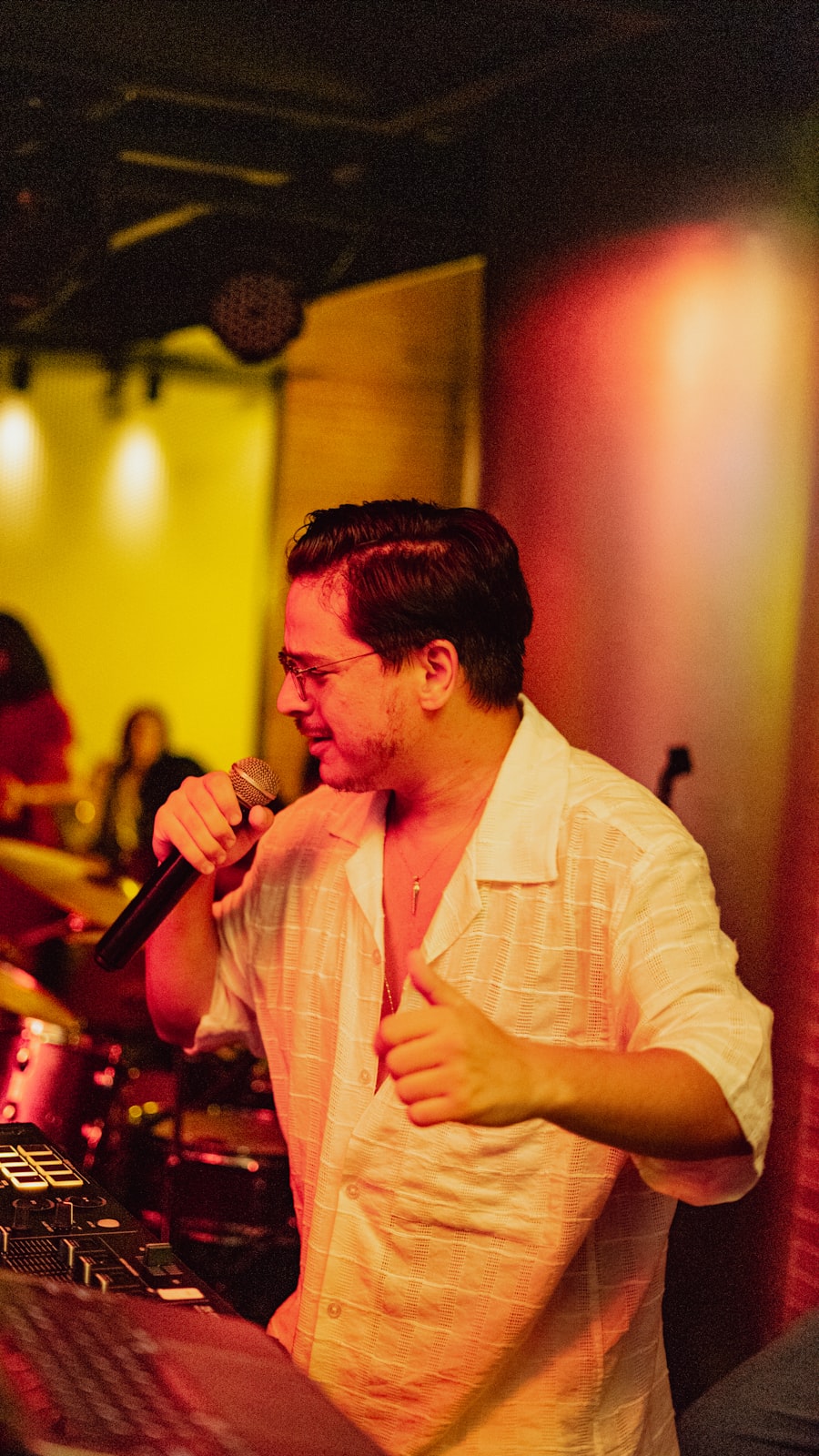 Singer performing under colorful stage lights