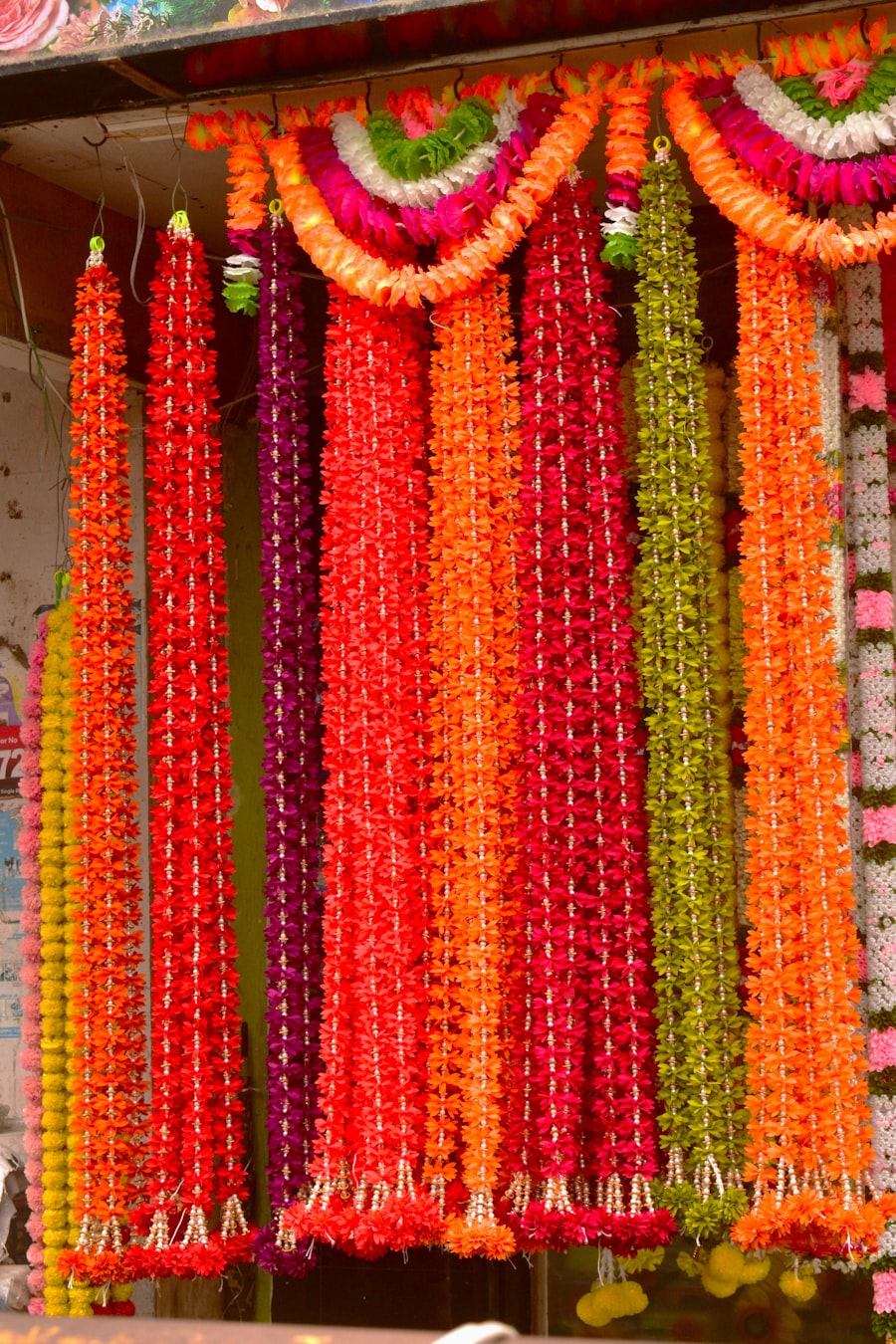 Rows of colorful flower garlands ready for a wedding