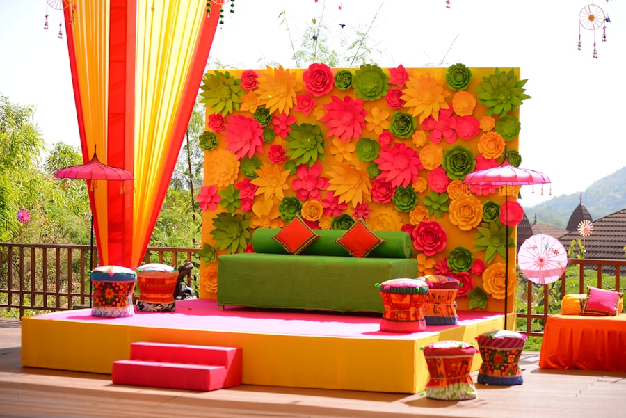 Colorful flower wall backdrop for a mehendi stage