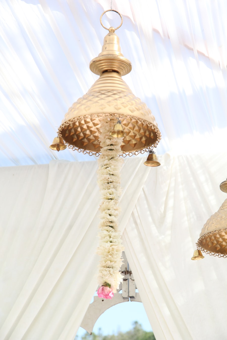 Jasmine garland hanging from a golden lantern