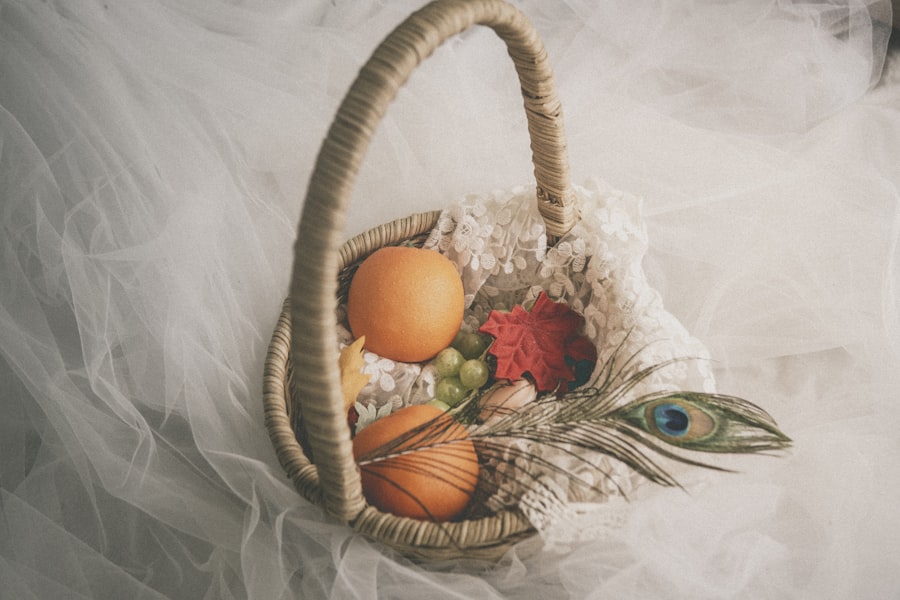 Fruit gift basket with a peacock feather and lace trim