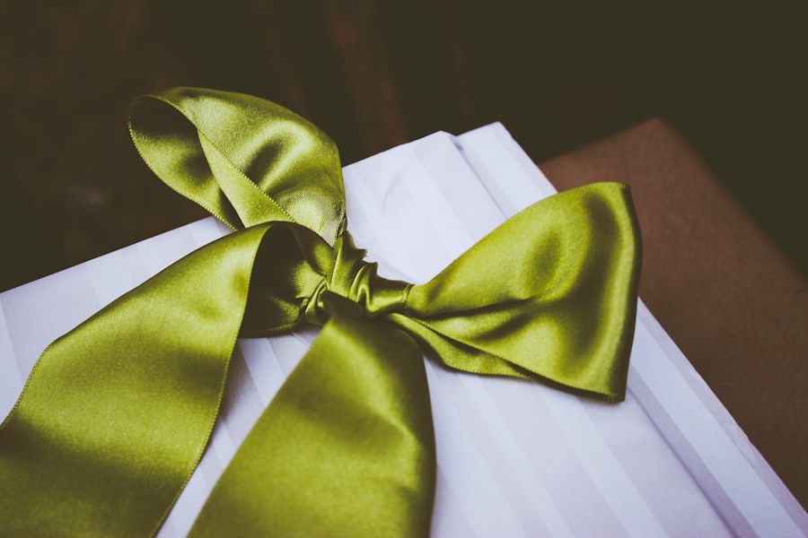 Gift box tied with a green satin ribbon bow