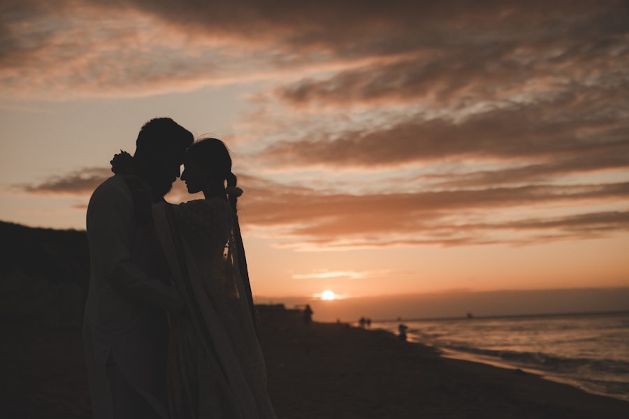 Couple embracing on the beach at sunset