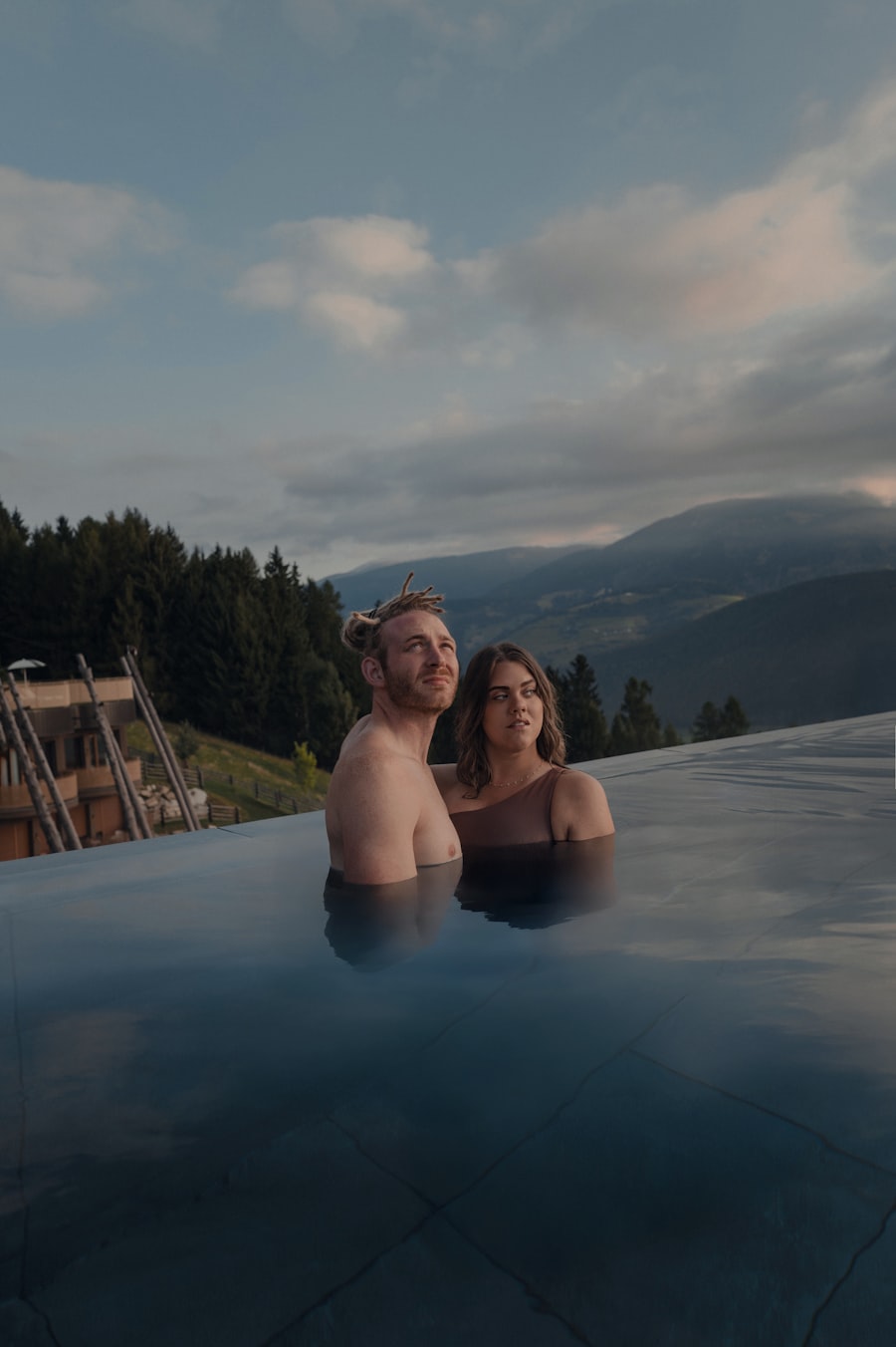 Couple enjoying an infinity pool with mountain views