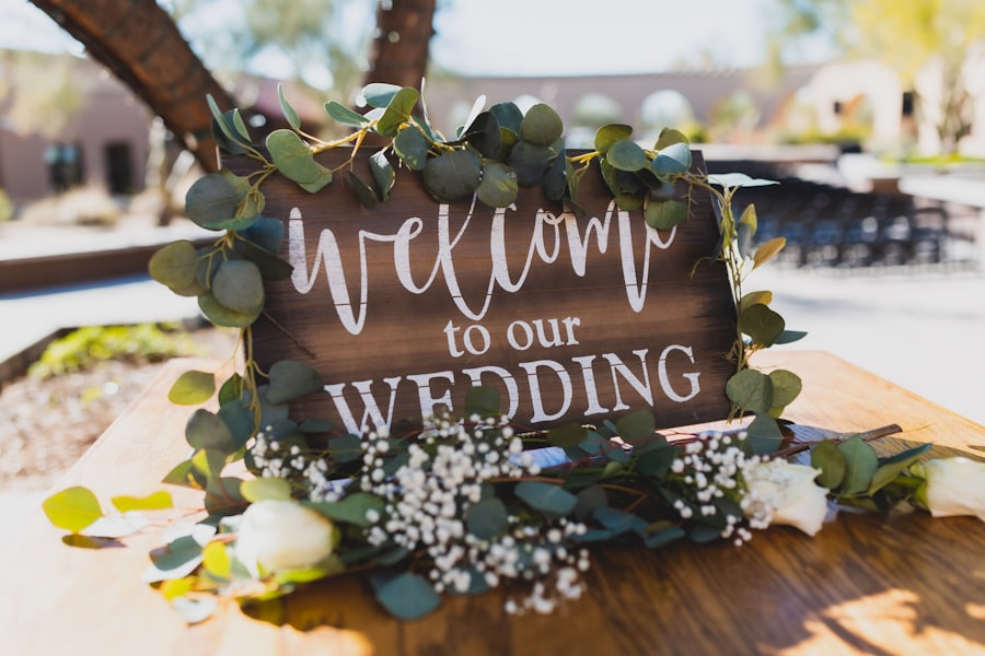 Welcome to our wedding sign decorated with eucalyptus and roses