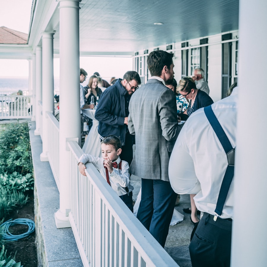 Guests mingling on a veranda during a wedding reception