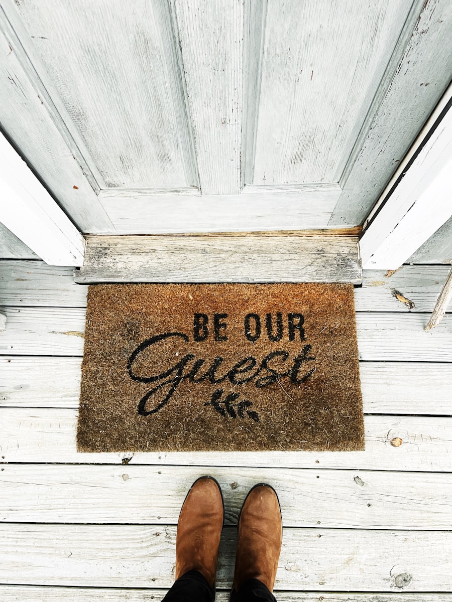 Be Our Guest welcome mat at a front doorstep