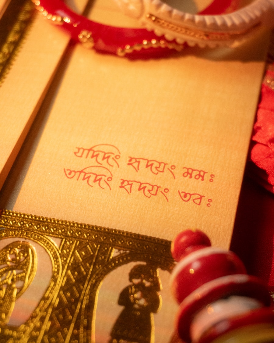 Wedding card with peacock motif and gold bangles