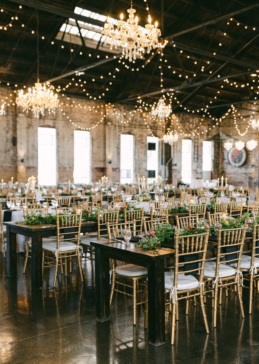 Reception hall strung with fairy lights and crystal chandeliers