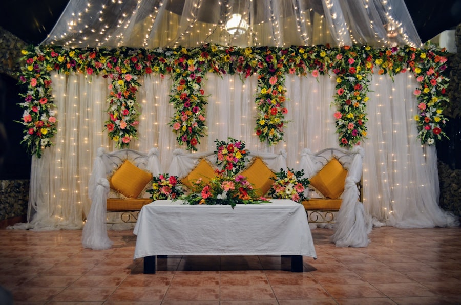 Wedding stage lit in blue with a gold seating area