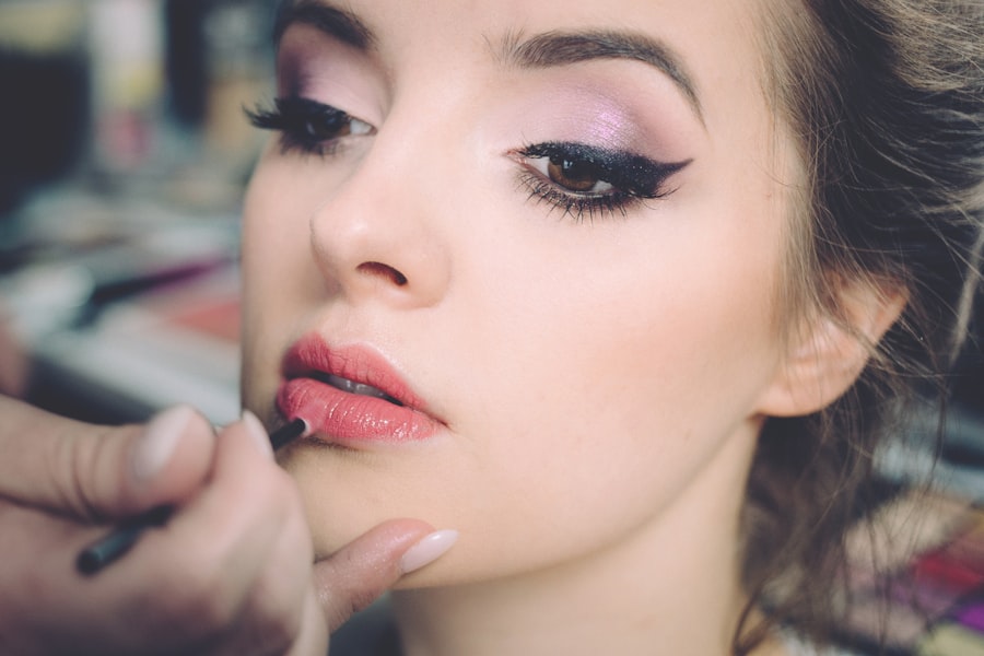 Makeup artist applying lip color for a bridal look