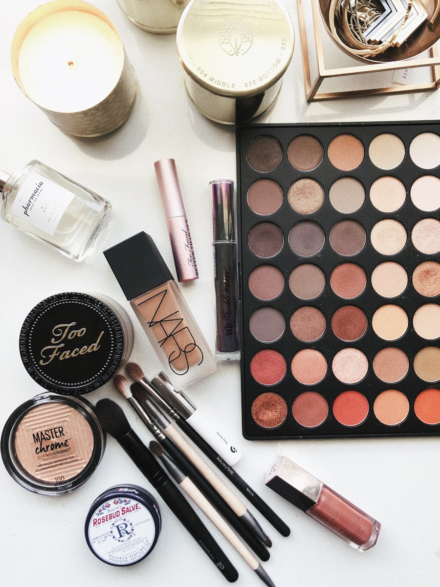 Professional makeup palette, brushes, and cosmetics laid out