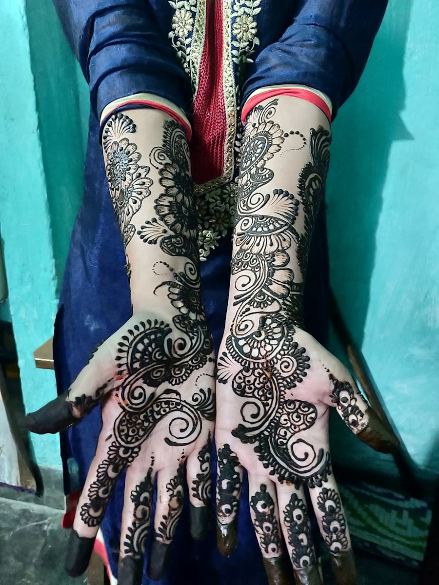 Detailed henna covering both hands and forearms