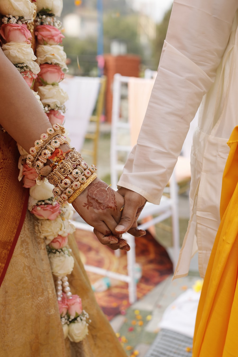 Couple holding hands during a ritual blessing