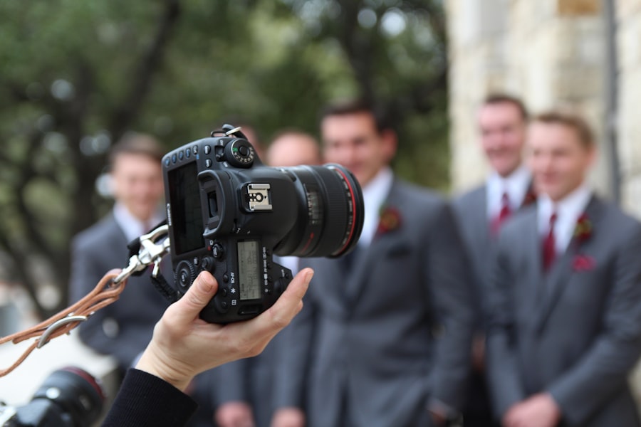 Photographer's camera capturing groomsmen at a wedding