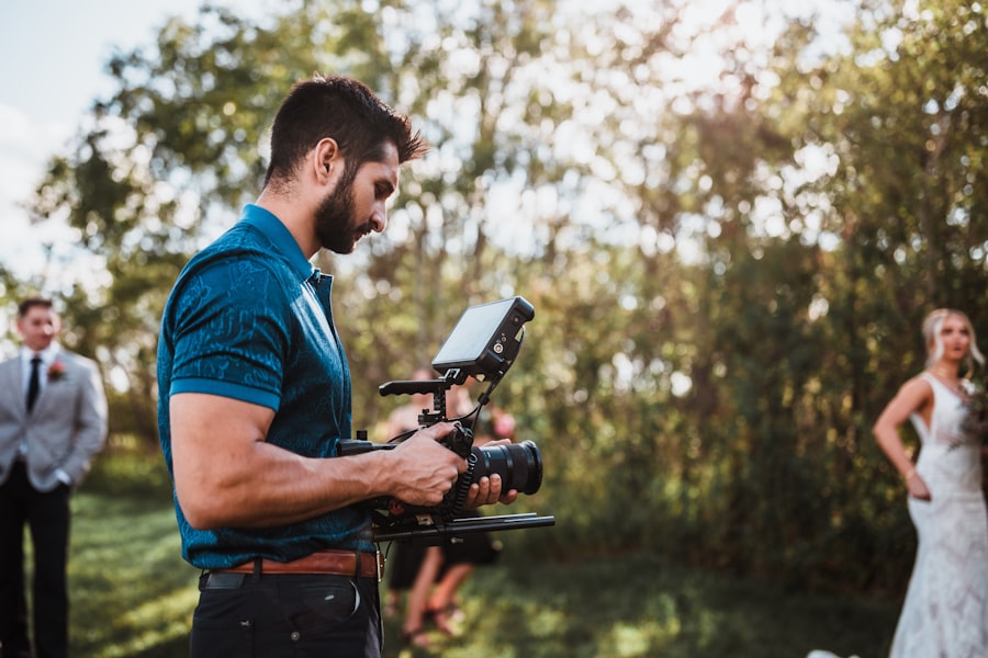 Videographer filming a wedding ceremony outdoors