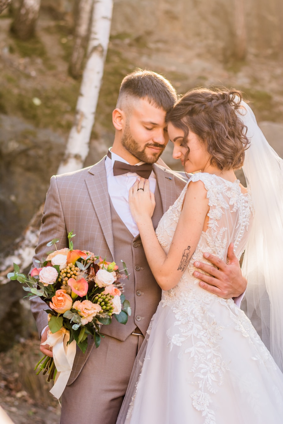 Bride and groom sharing a tender moment with a bouquet