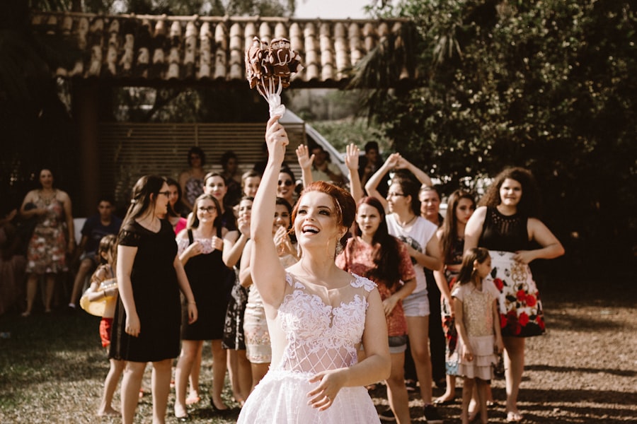 Bride tossing her bouquet to a joyful crowd