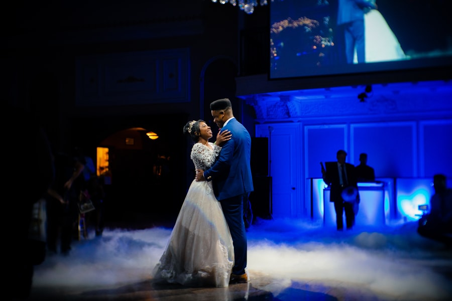 Couple dancing on stage in rolling fog and blue light