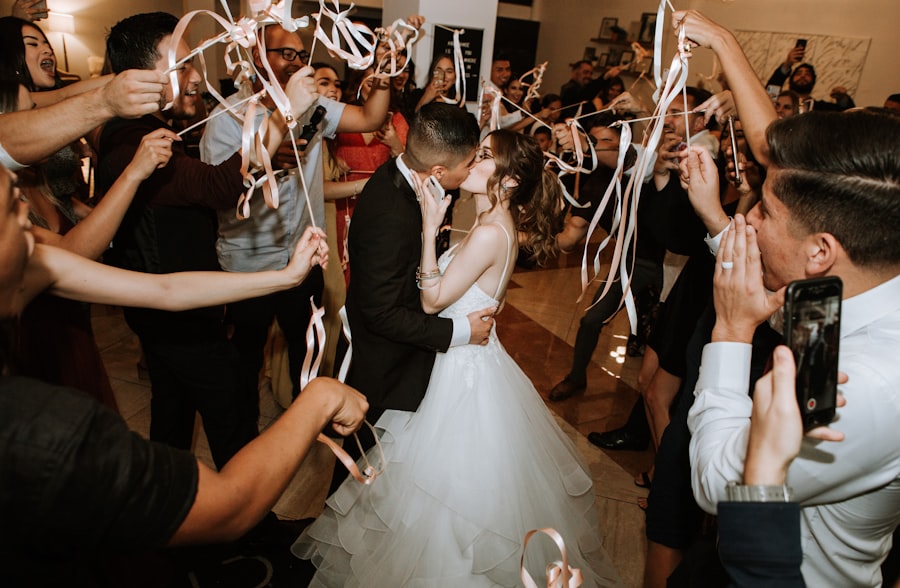 Bride and groom sharing a first dance on a lit stage