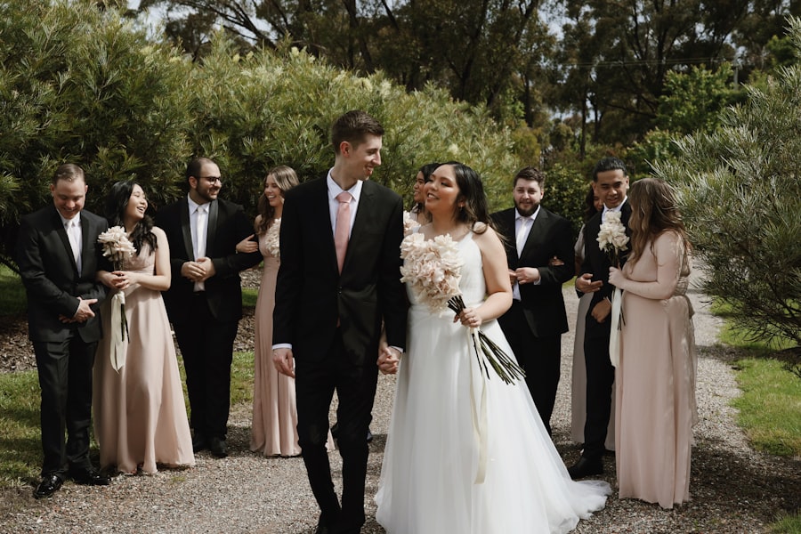 Bride and groom walking together with their wedding party