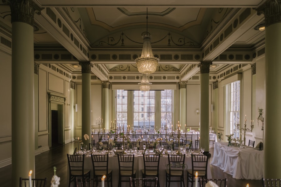 Green-pillared ballroom with grand chandelier