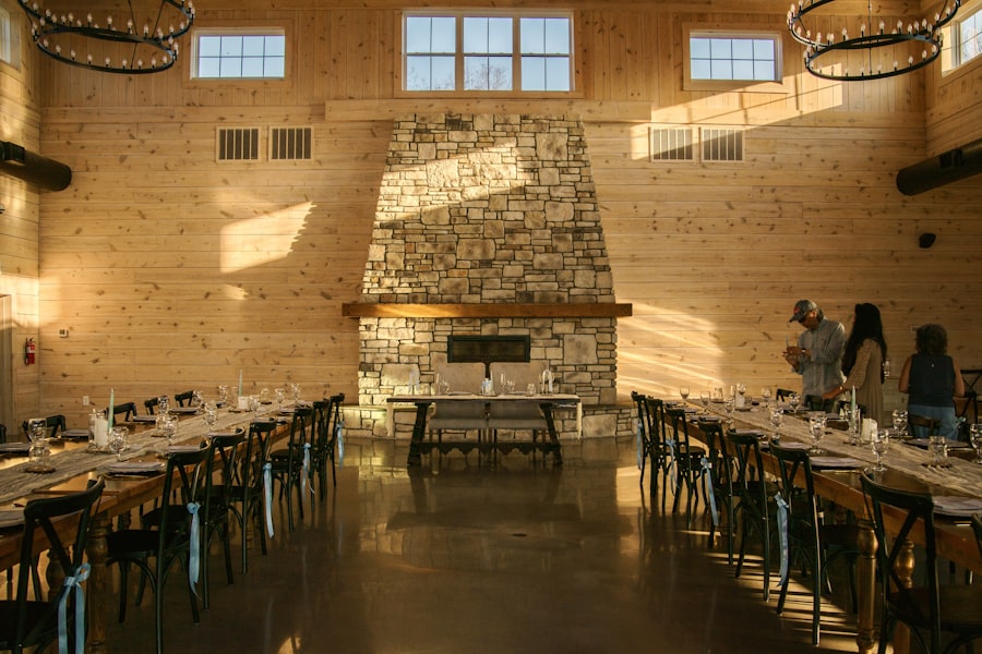 Rustic barn venue with vaulted wood ceiling and stone fireplace