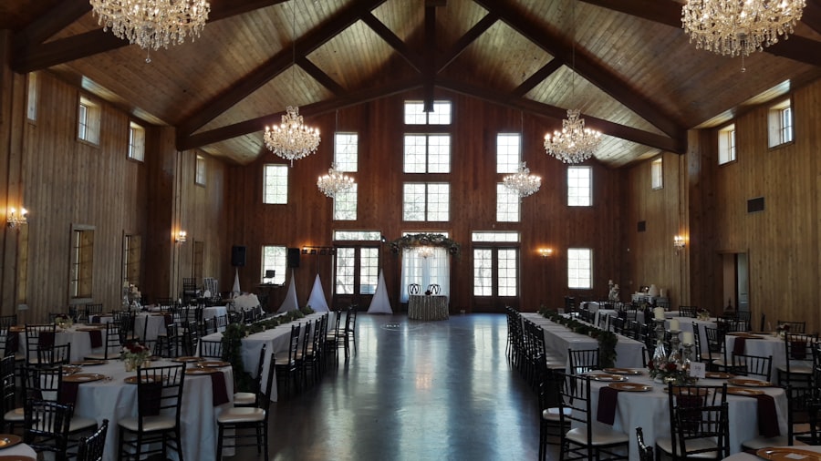 Rustic venue with wooden beams and floral table settings